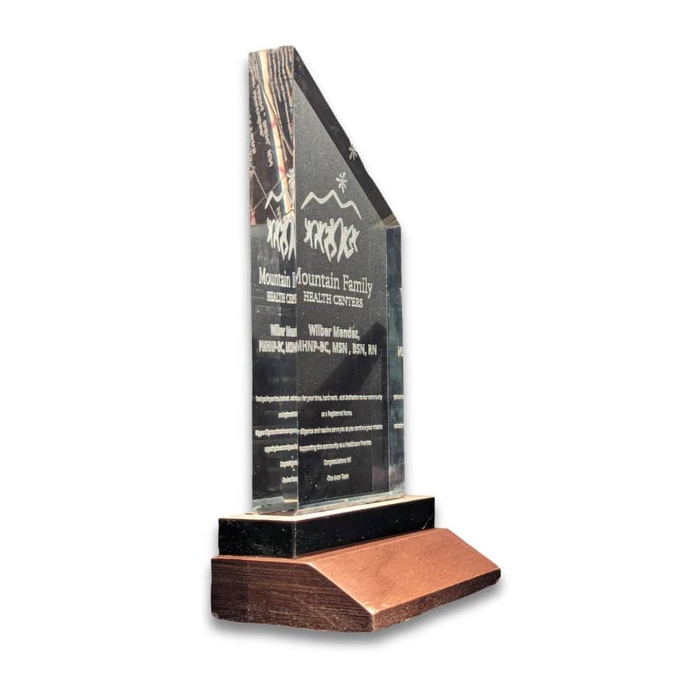 Clear acrylic award with peak on wooden stand. Elevated Engravings.