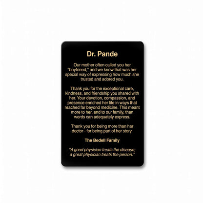 A black rectangular memorial plaque with rounded corners, featuring a printed personalized tribute to Dr. Pande in white and gold text, shown against a plain white background.