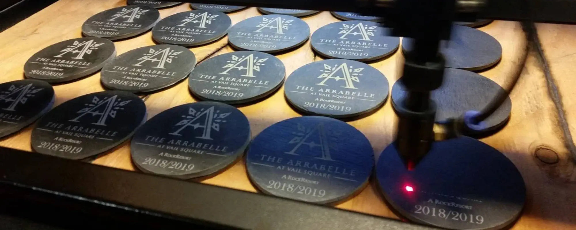 Black custom coaster and custom drink coasters for The Arrabelle at Vail Square