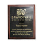 Dark stained wood plaque with black plate engraved for Bravo Vail in Colorado.